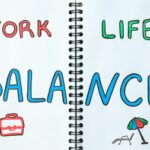 Concept of work-life balance, writing in notebook.