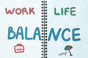 Concept of work-life balance, writing in notebook.