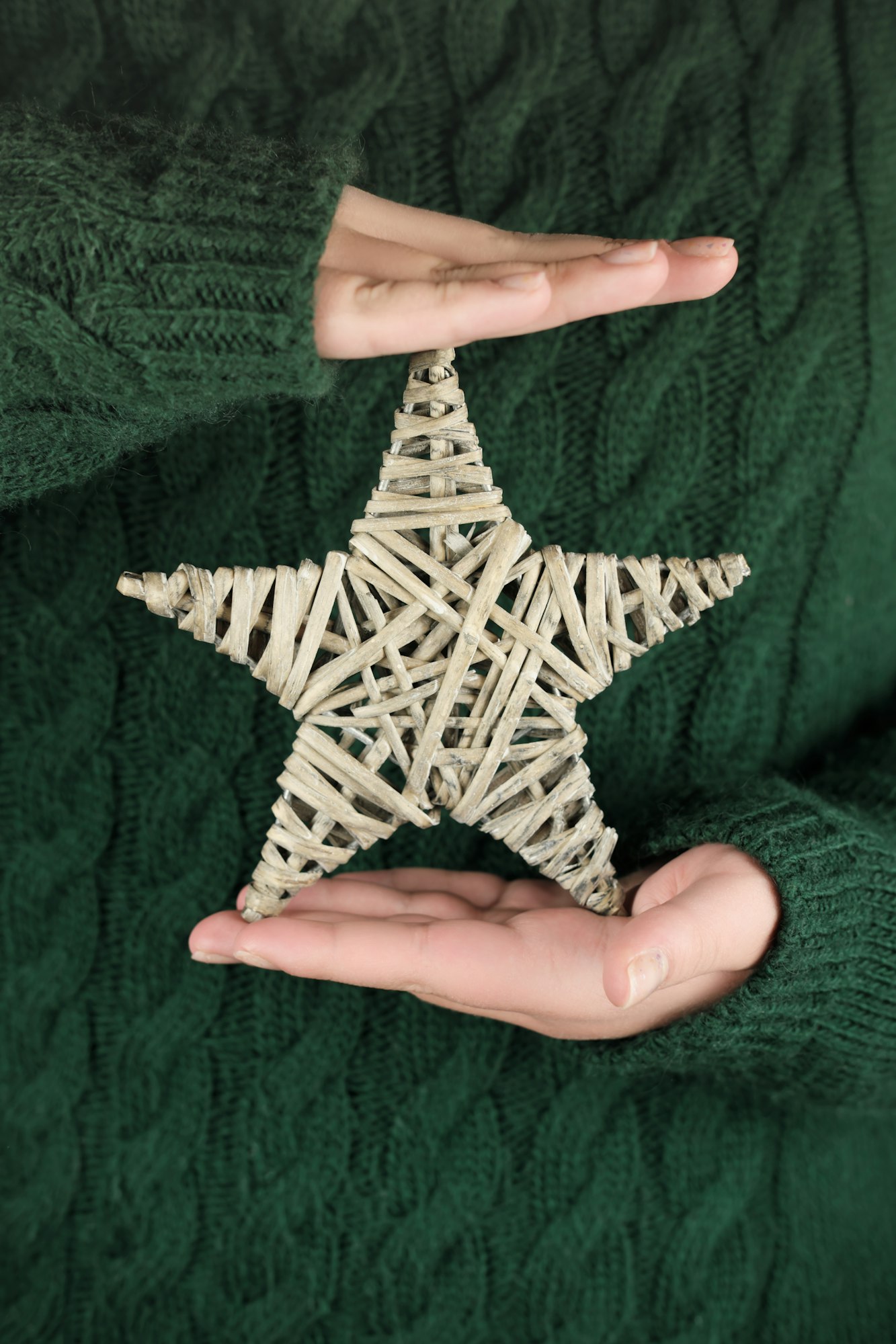 female hands holding eco christmas star.